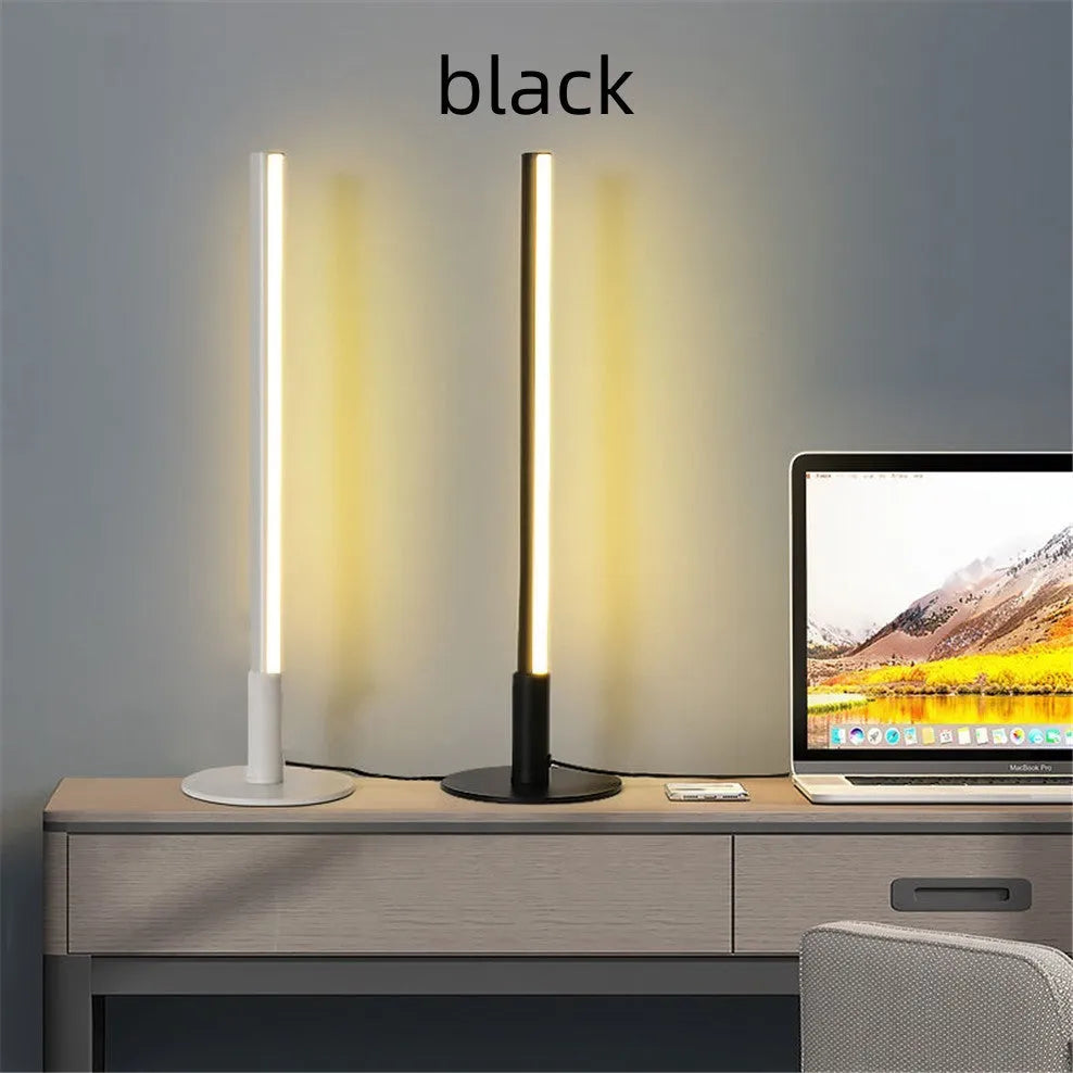 Simple retro black decorative atmosphere lamp with aluminium alloy body on a side table.