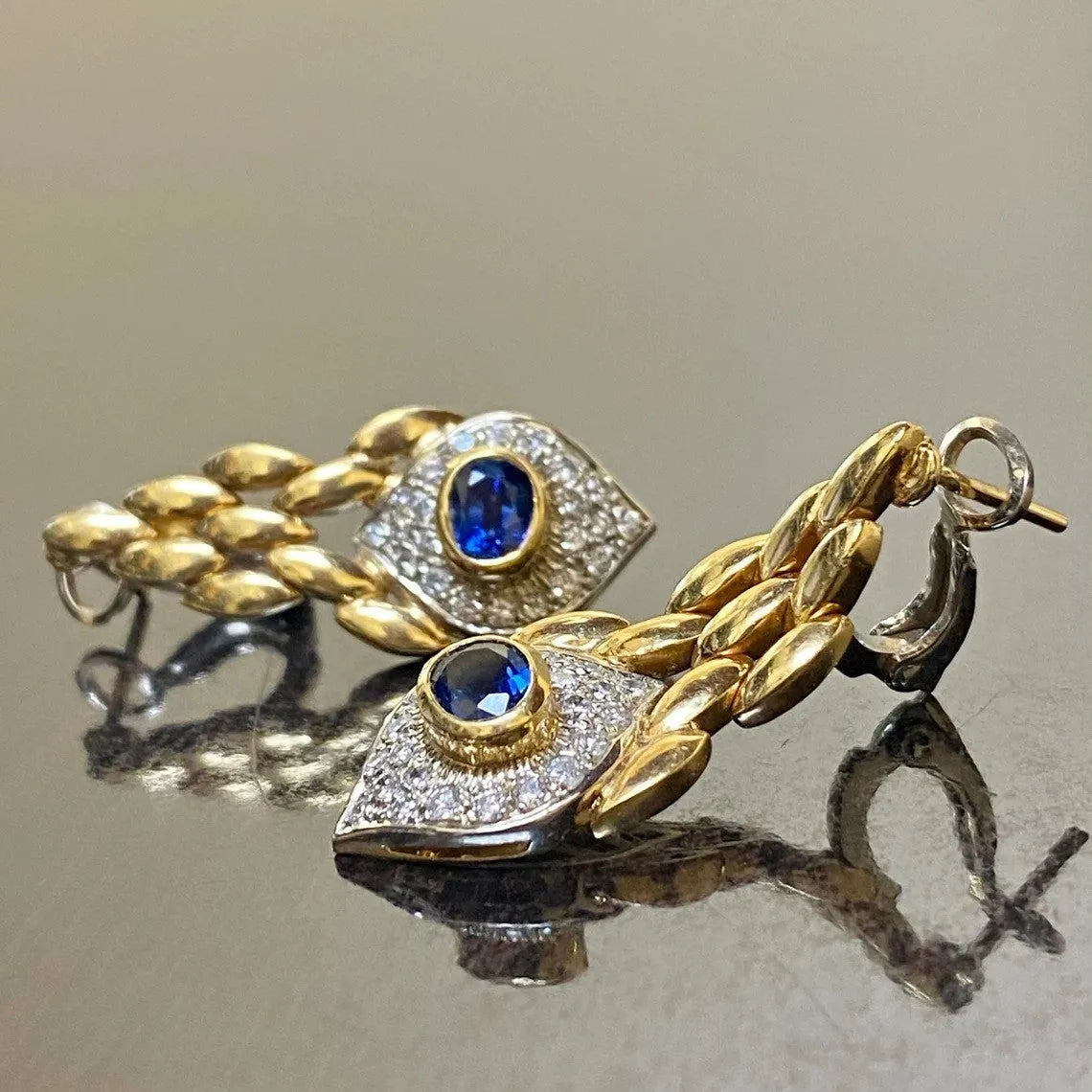 Pair of women's snake motif drop earrings in imitation gold with electroplated alloy finish