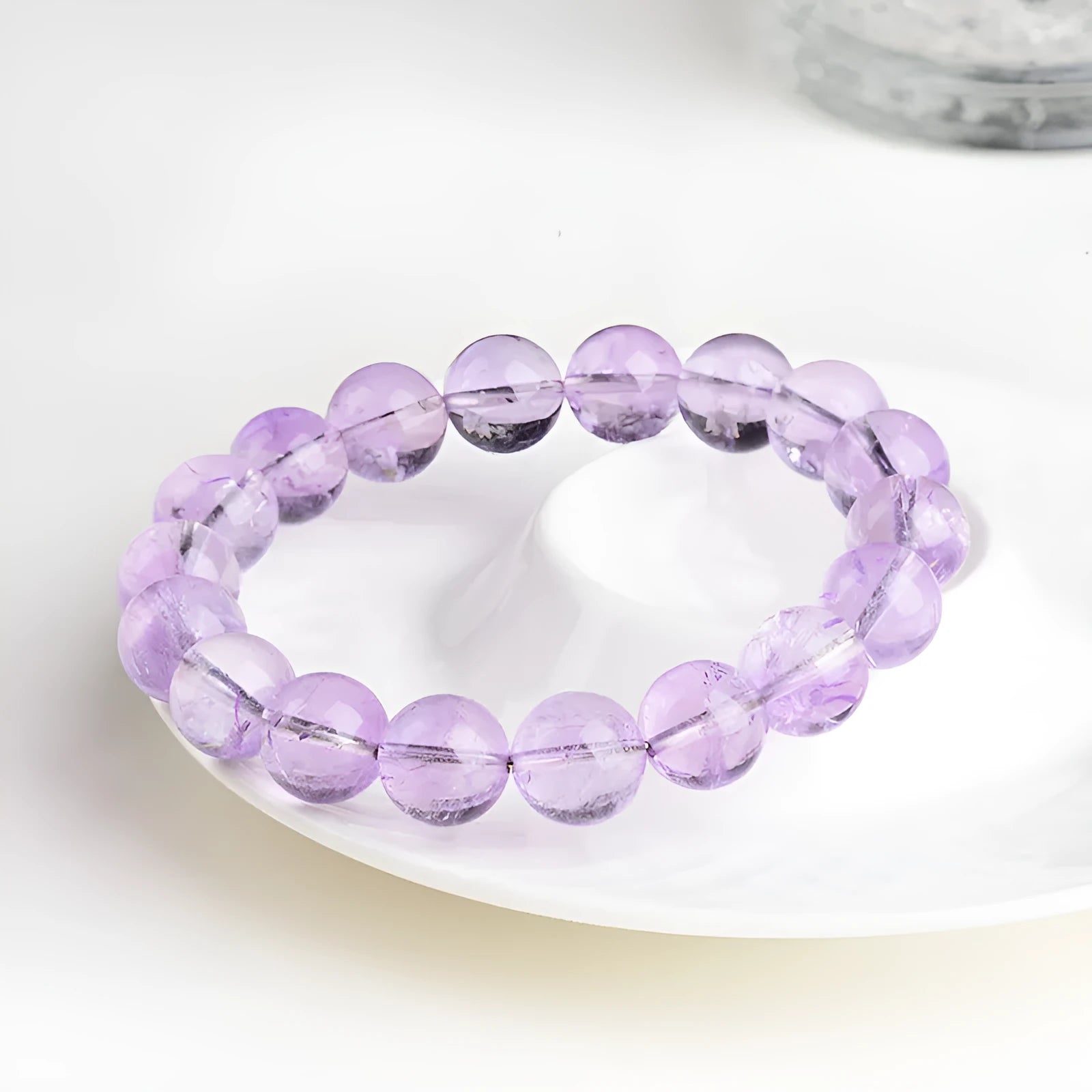 Lavender coloured amethyst crystal bead bracelet with round geometry shape and water ripple design.