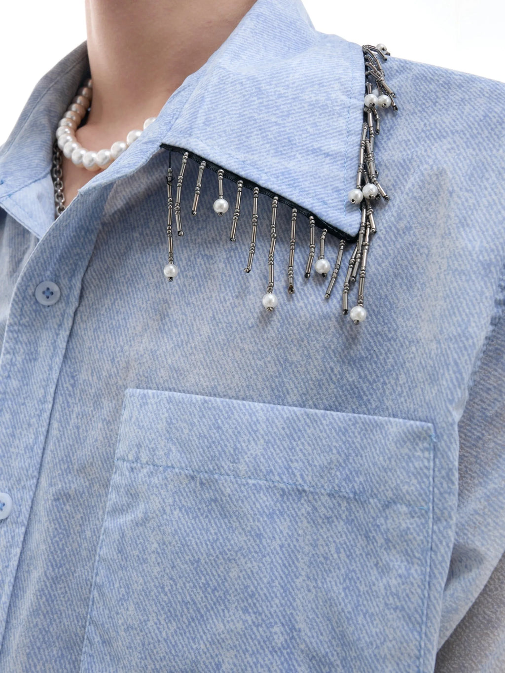 Blue and white gradient short-sleeved casual shirt on a hanger.