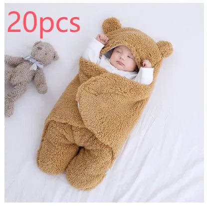 Baby quilted sleeping bag wrapper in cotton blend fabric, shown in a light blue colour.