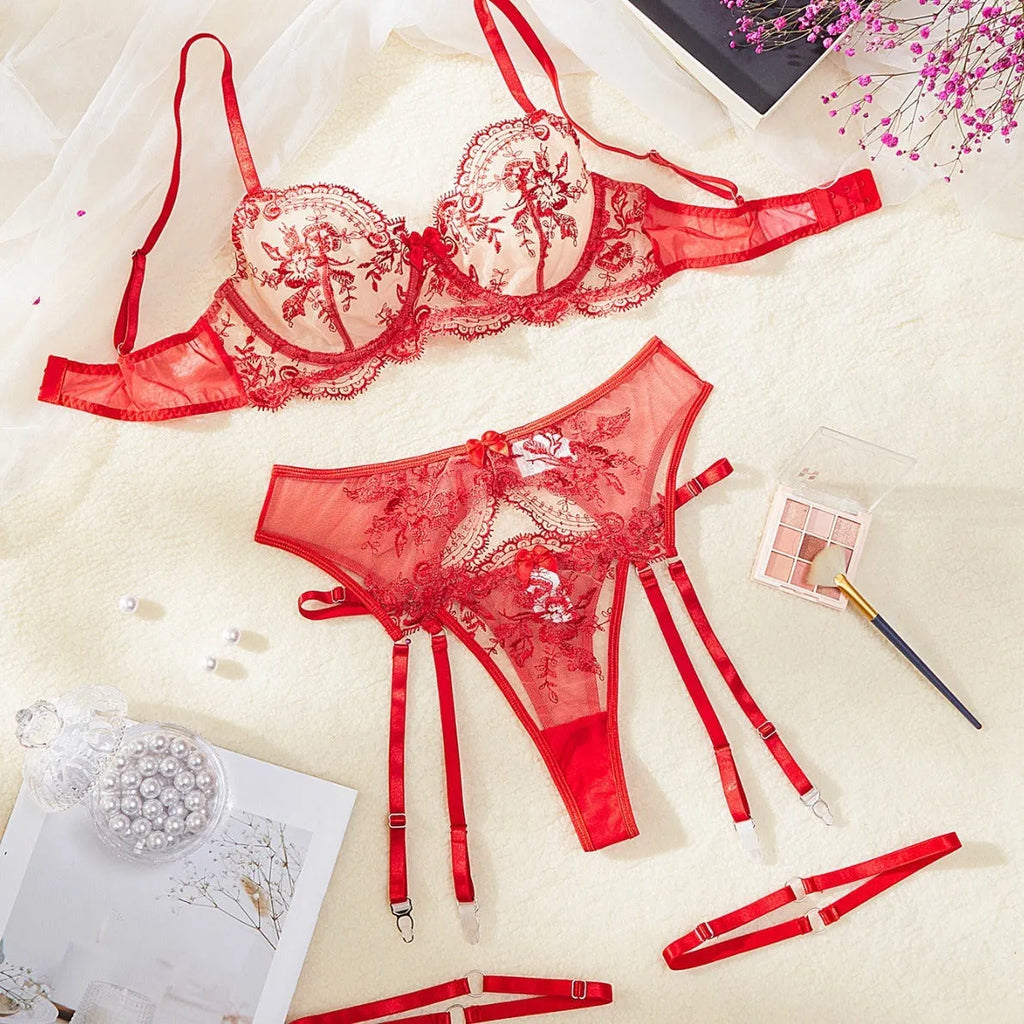 Sapphire blue women's see-through embroidered underwear set with cutouts, includes top, pants, and garters.