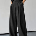 Men's black casual trousers with vertical stripes and pleated front in high-elasticity fabric