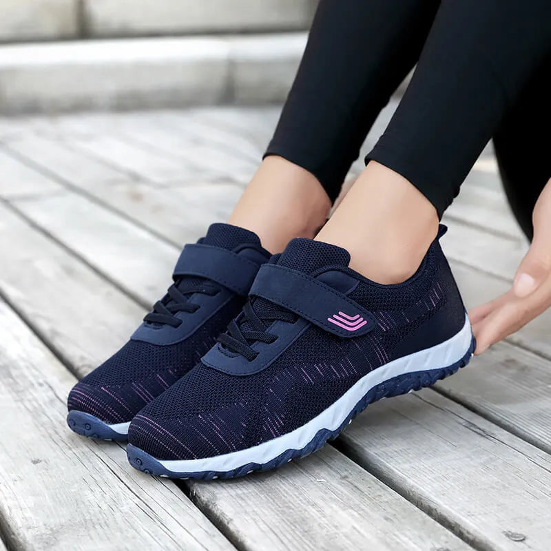 Women's low-top wedge heel shoes in grey purple with velcro strap and mesh upper.