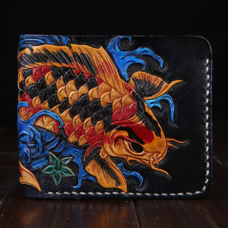 Men's blue hand-carved leather bifold wallet showing card slots and note compartment, placed on a wooden surface.