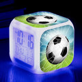 Square cartoon football pattern mute alarm clock for students and children on a desk.