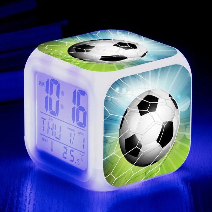 Square cartoon football pattern mute alarm clock for students and children on a desk.