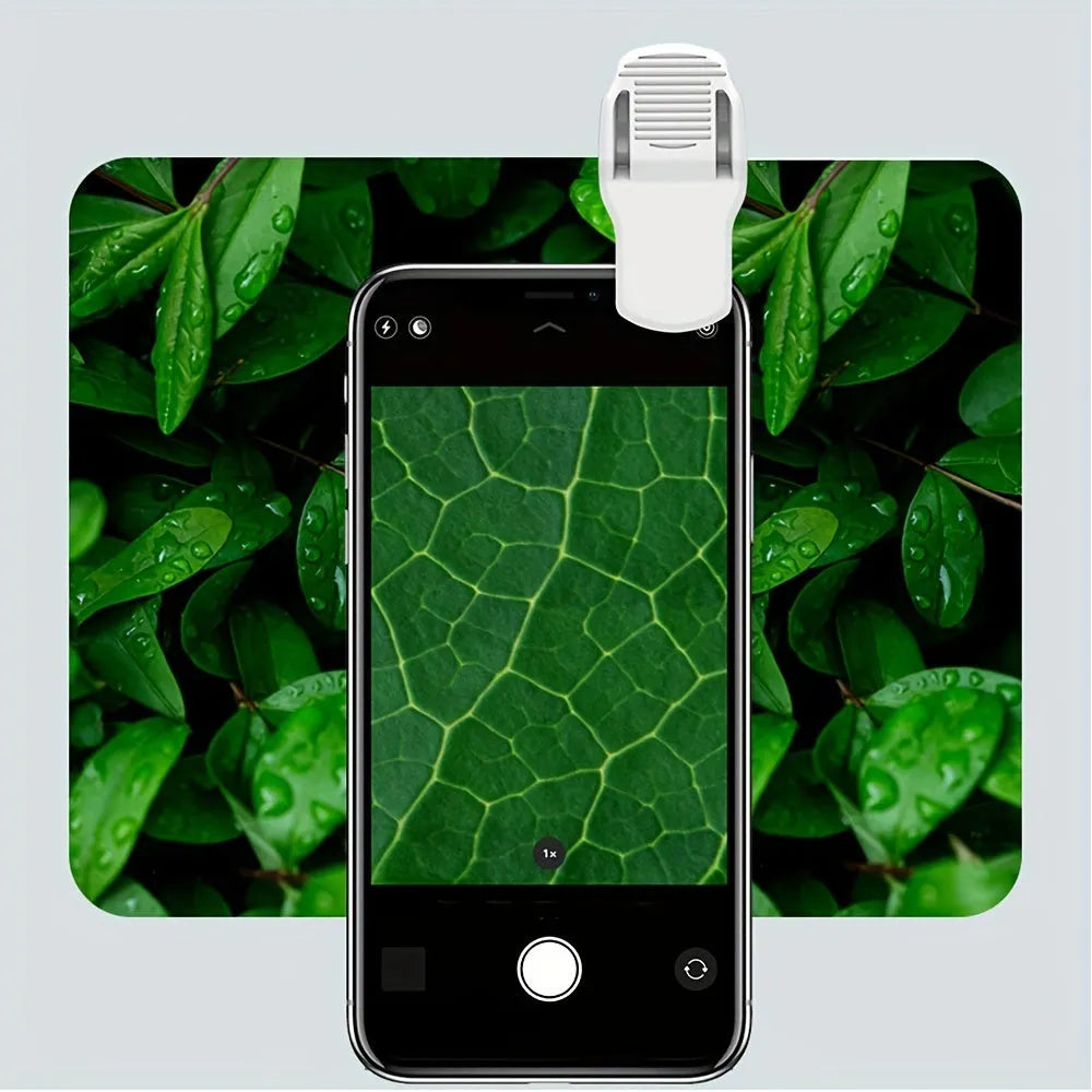 Mini 60x magnification mobile phone microscope with LED light and detachable phone clip on a white background.
