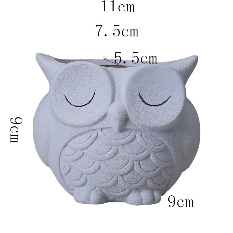 Handmade frosted owl ceramic succulent pot in light pink, showing cartoon design and 11cm size.
