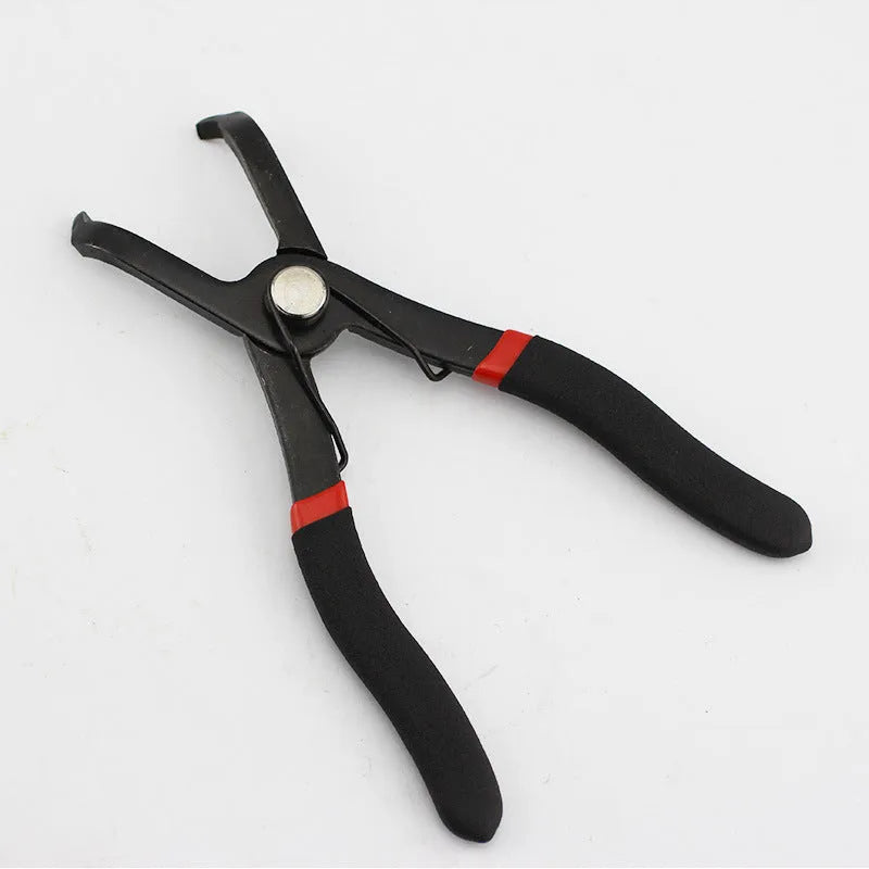 Red round nail removal pliers with PVC handles and adjustable jaws for interior trim work