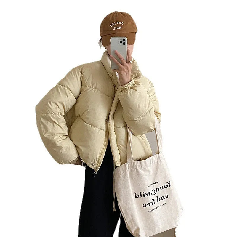 Women's loose thick polyester padded coat with zip front, available in seven solid colours and sizes S to L