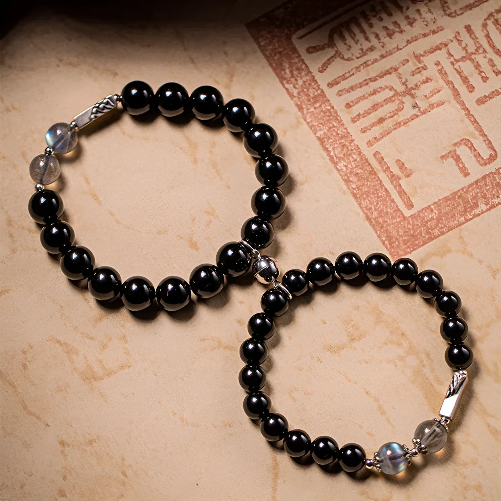 Obsidian Buddha beads couple bracelet set showing 8mm and 10mm stone beads in national style design