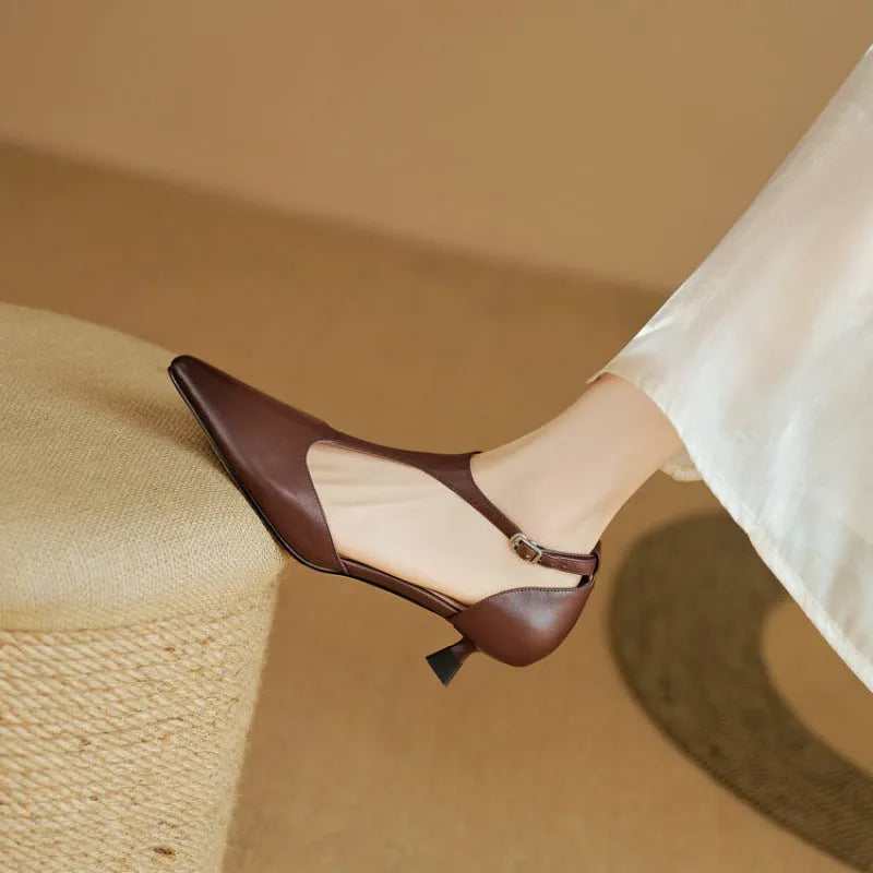 Brown and black women's pointed toe high heels made from cowhide leather.
