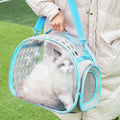 Transparent EVA cat backpack carrier in grass green colour showing space capsule design