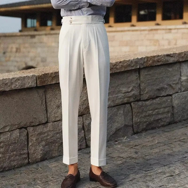 Men's slim fit straight leg suit trousers in black, white, or apricot colour on a hanger.