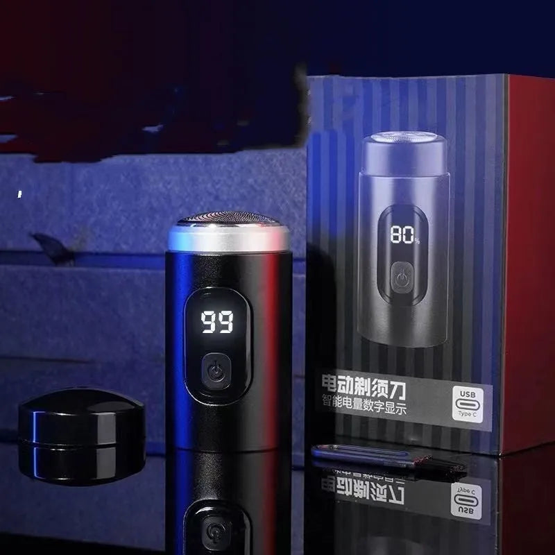 Black mini USB rechargeable electric shaver with cleaning brush and charging cable on a white background.