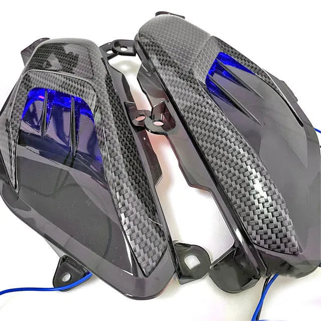 Pair of YAMAHA NMAX LED side lamps with carbon fibre trim, blue or red light option.