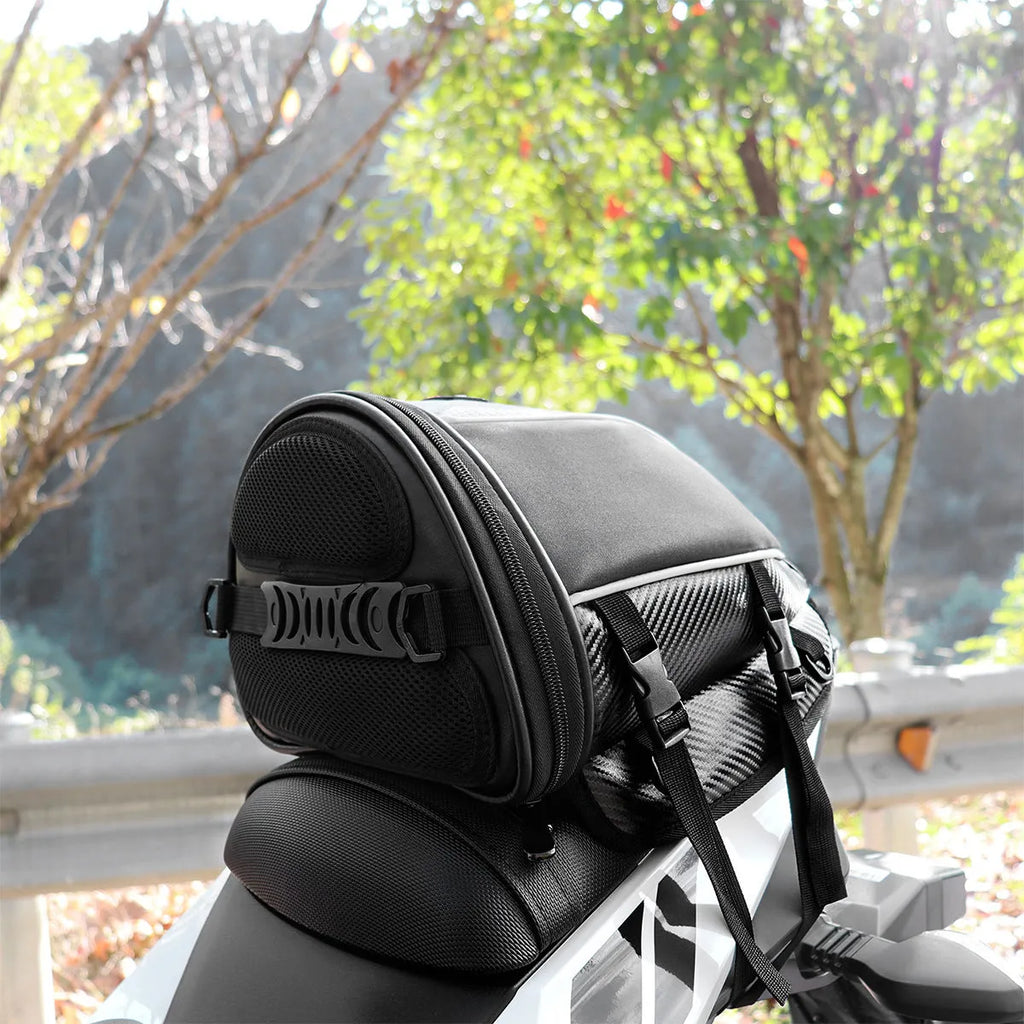 Black motorcycle seat bag with reflective lines and adjustable hooks for fuel tank or rear seat mounting