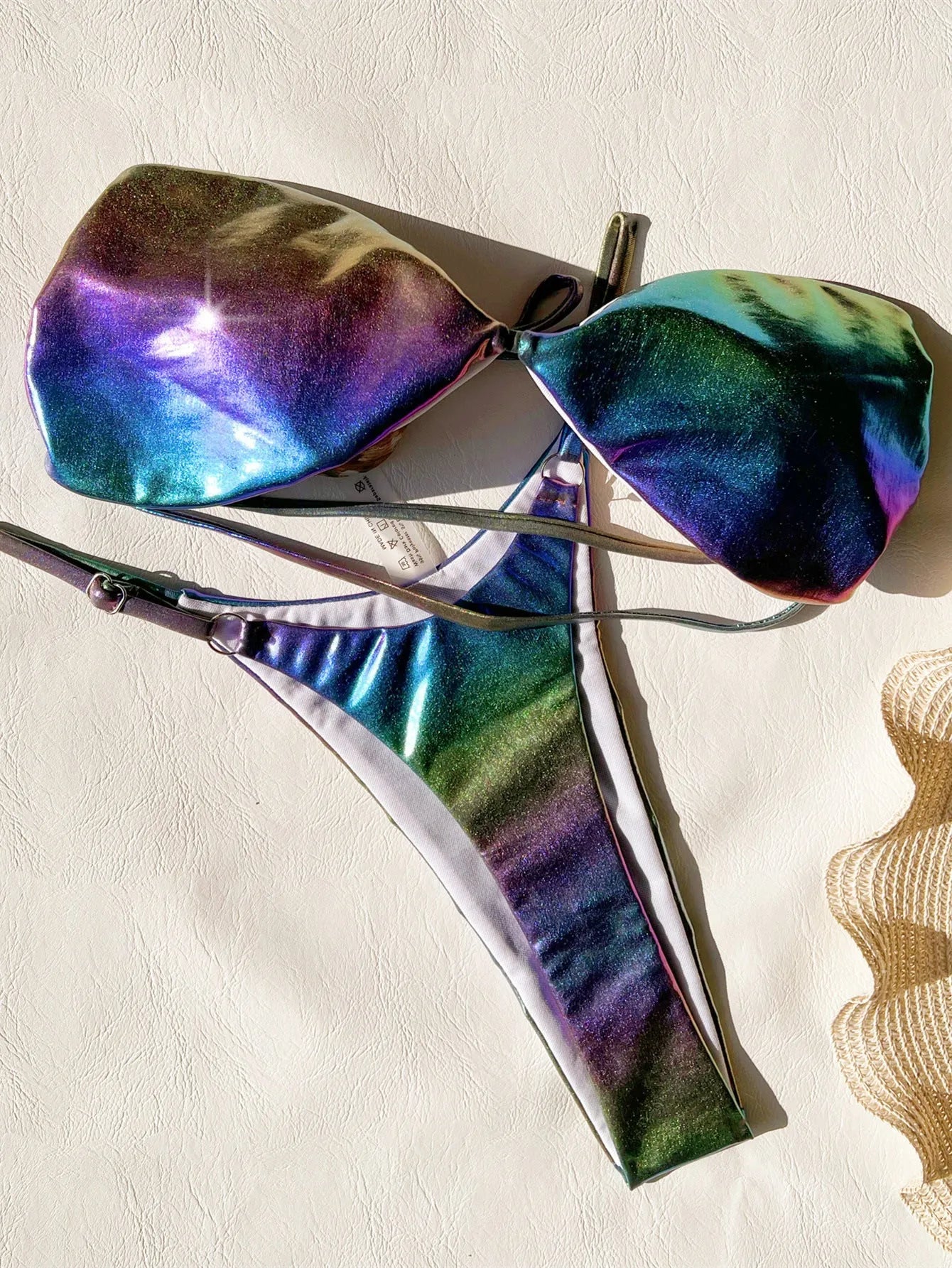 Women's gradient purple bikini swimsuit on a mannequin, showing the two-piece design.