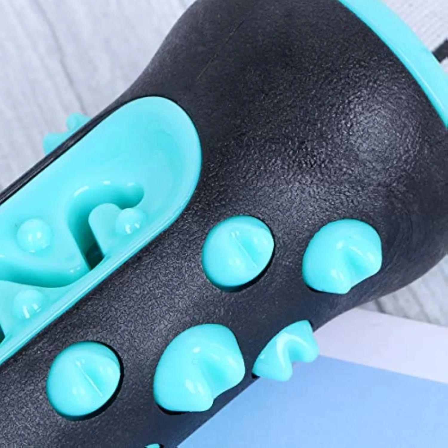 Natural rubber dog dental chew toy in four colours, showing textured surface for teeth cleaning.