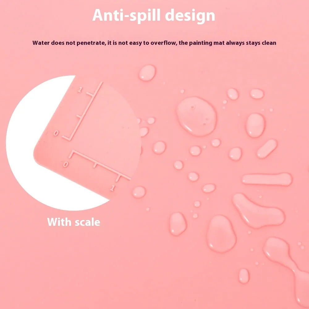 Green silicone painting mat measuring 50 by 40 cm, shown with two integrated bowls for paint or water.