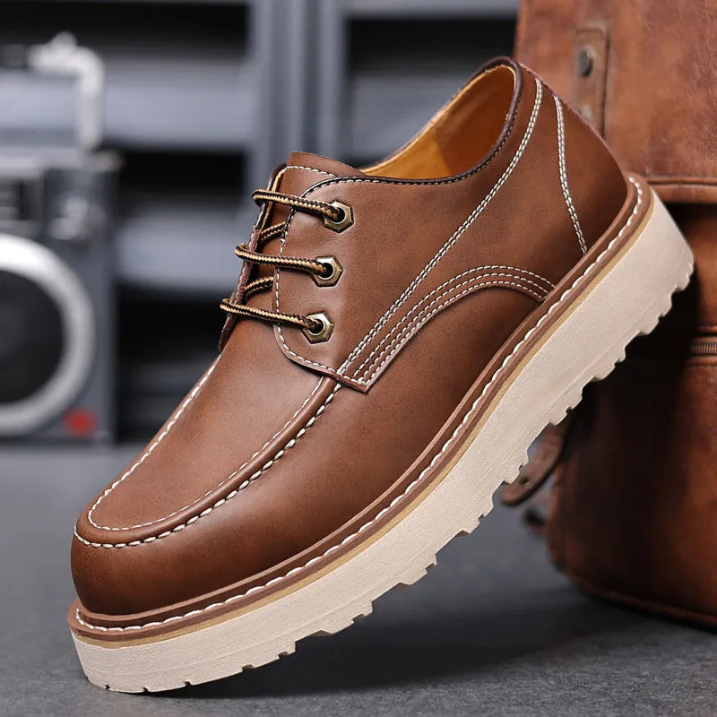 Men's black retro low-top casual worker boots with a rounded toe and rubber sole.