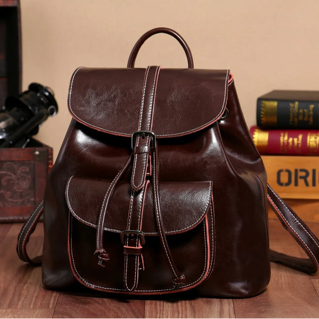 Korean style black cowhide leather backpack with front pocket and pull-belt