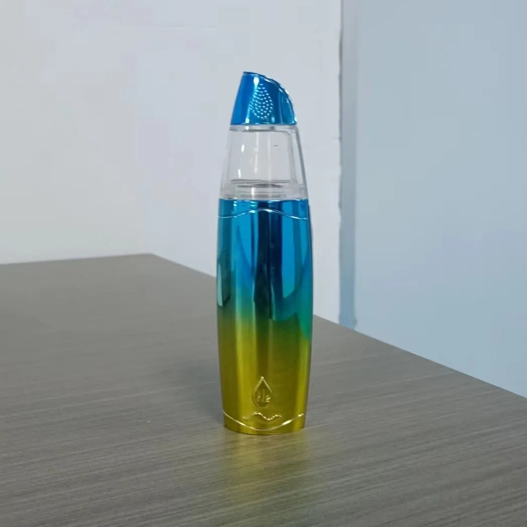 Peacock blue handheld facial steamer with USB charging port for skincare hydration.
