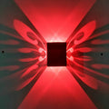 Modern aluminium butterfly-shaped LED wall lamp with remote control for seven colour options.