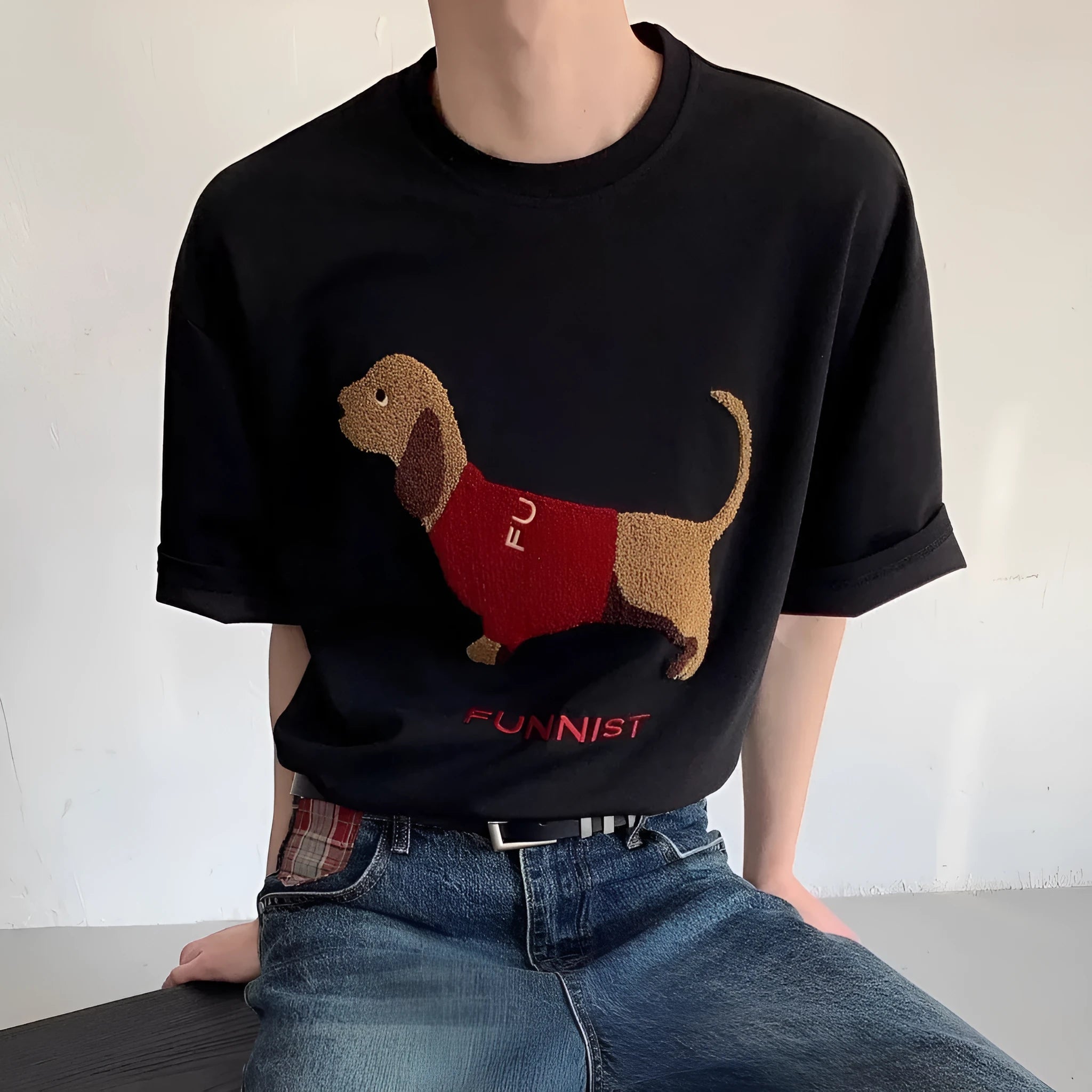 Men's gray cotton t-shirt with an embroidered cartoon sausage dog holding a blue towel.