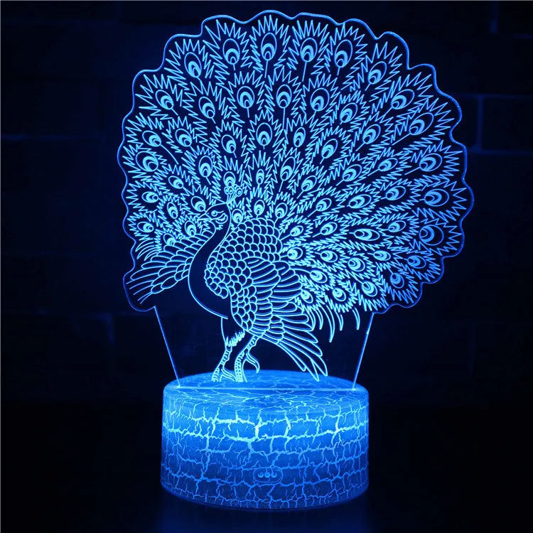 Small blue 3D acrylic USB table lamp with cracked base design lit up on a wooden desk.