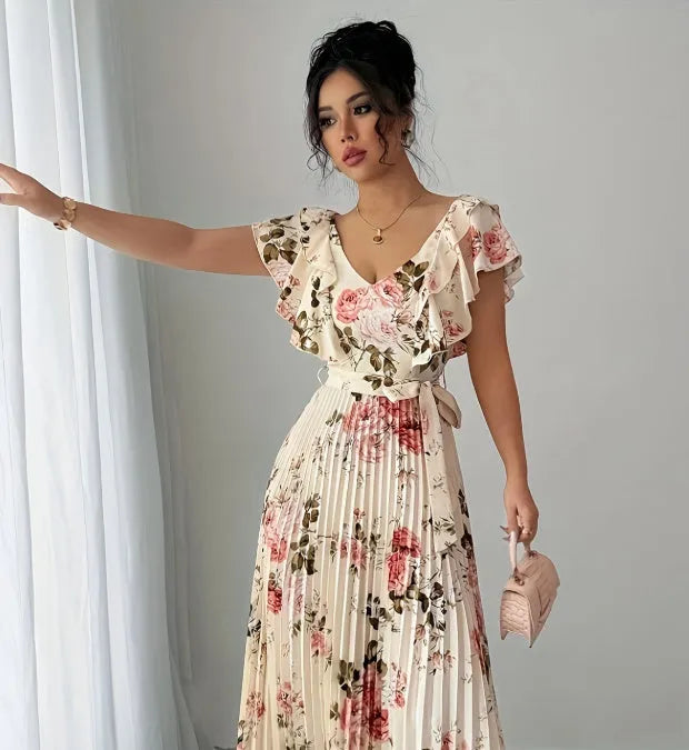 Apricot floral print women's dress with v-neck, ruffled sleeves, and a high-waisted long swing skirt.