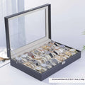 Grey high-grade leather watch storage box with a clear see-through lid, shown holding multiple watches.