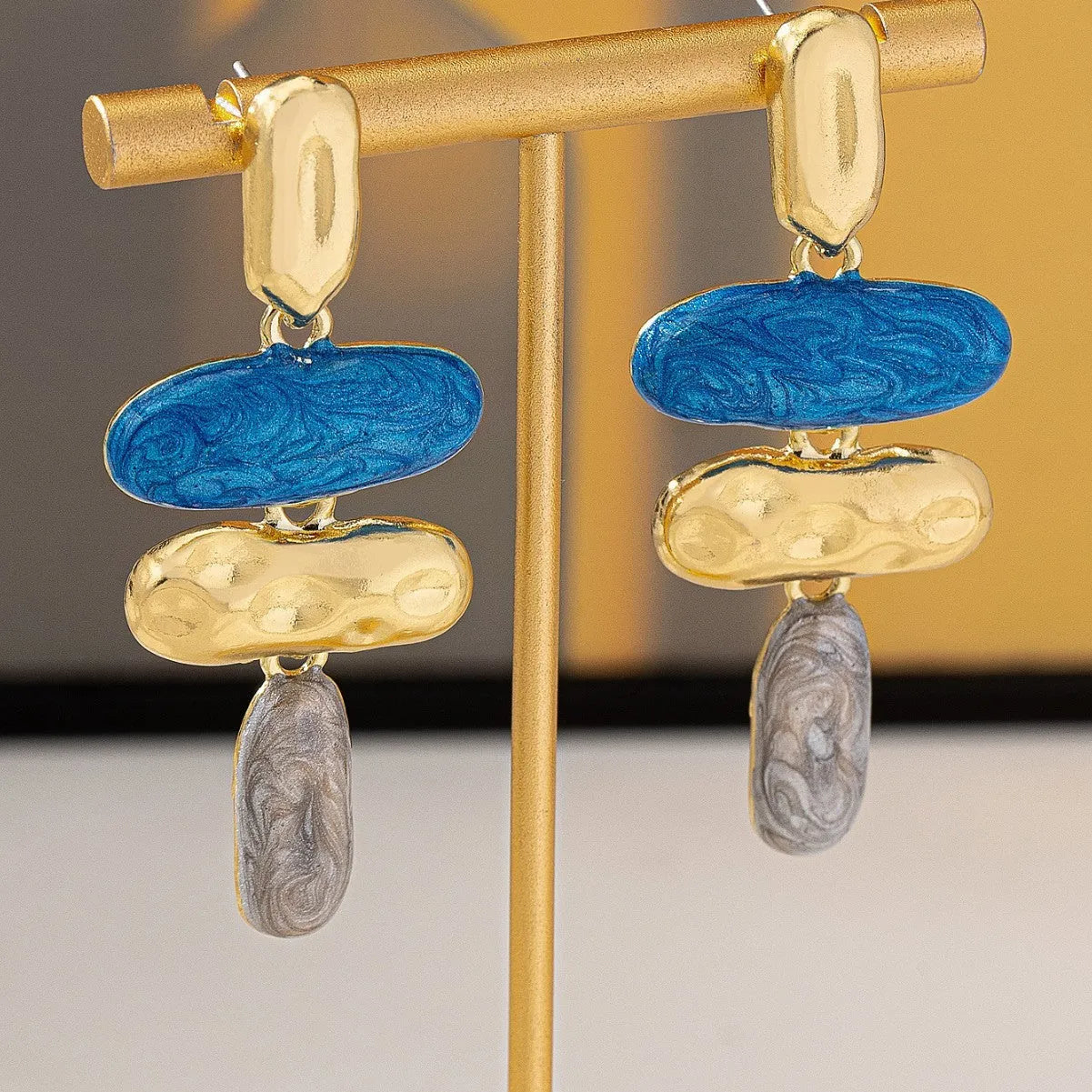 A pair of multicolour geometric stud earrings for women with a zinc alloy base and electroplated finish.
