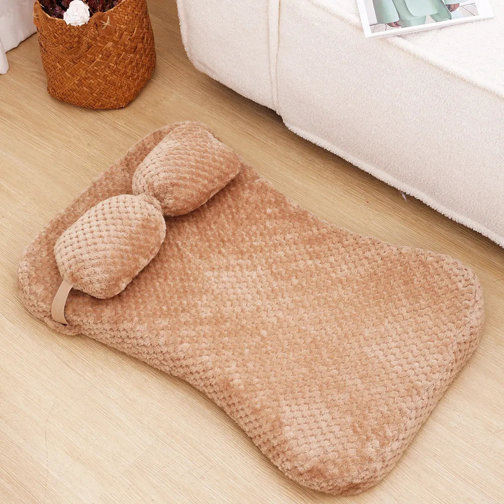 Soft plush pet bed mat with attached pillow in grey, available in sizes S to XL