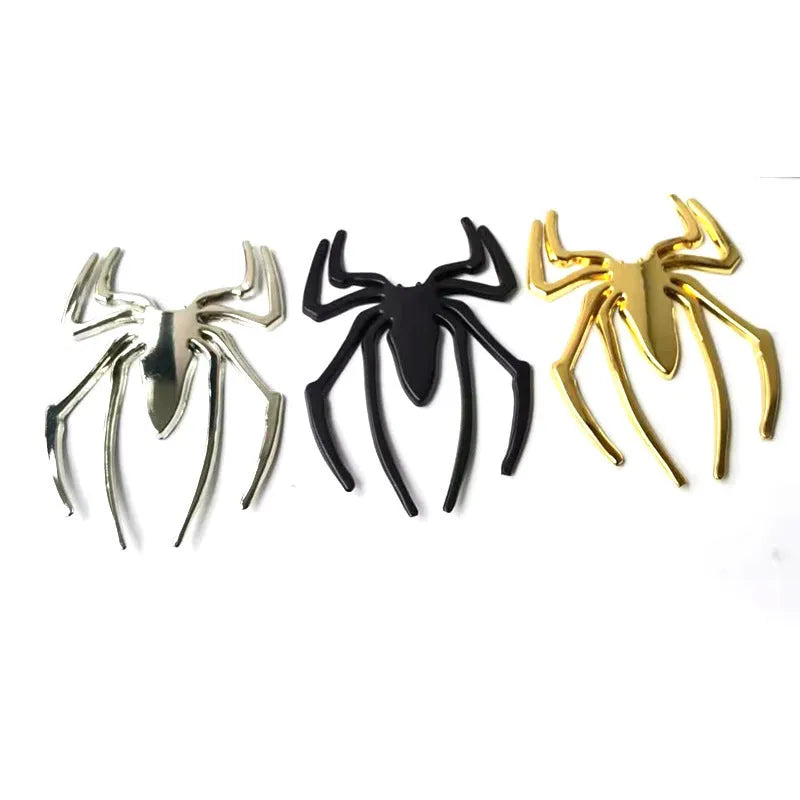 Three-dimensional metal spider car bumper sticker in gold, silver, black, and red colour options.