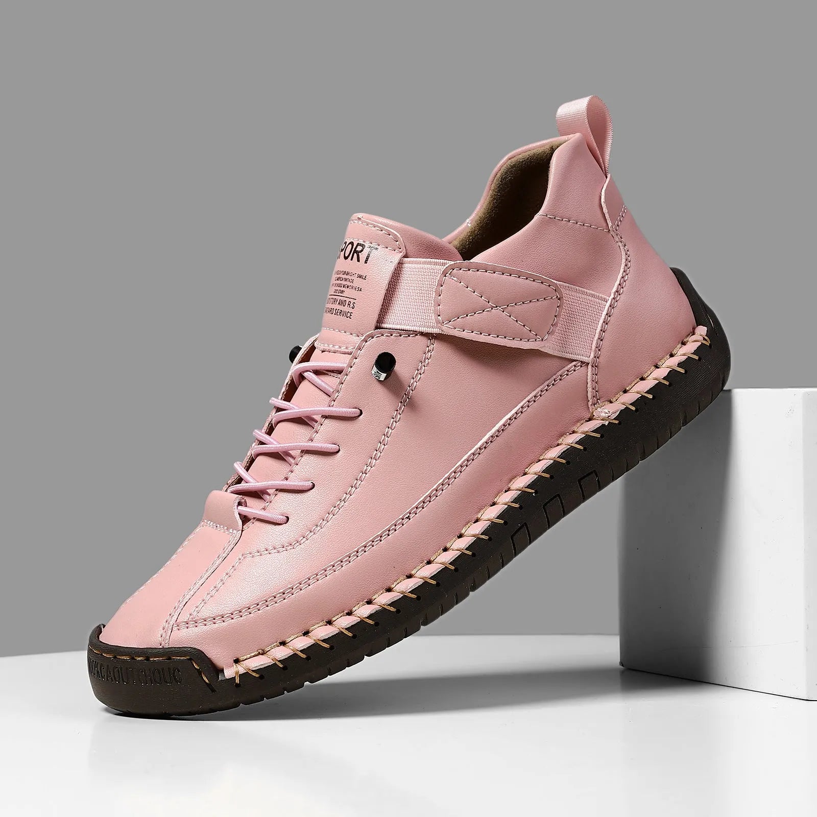 Men's mid-calf Martin boots in khaki with visible tooling stitching and an elastic band across the instep.