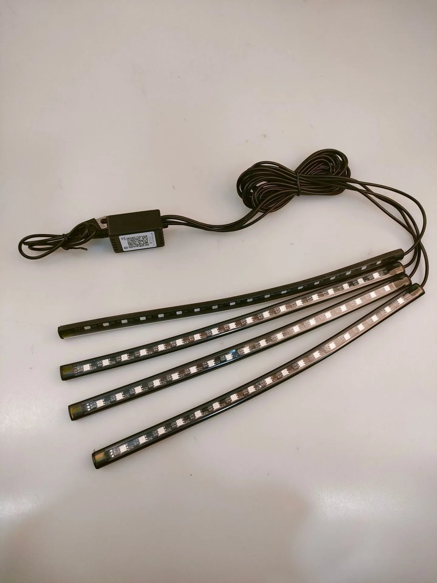 Boxed car interior LED atmosphere light kit with voice control and USB cable for APP connection.