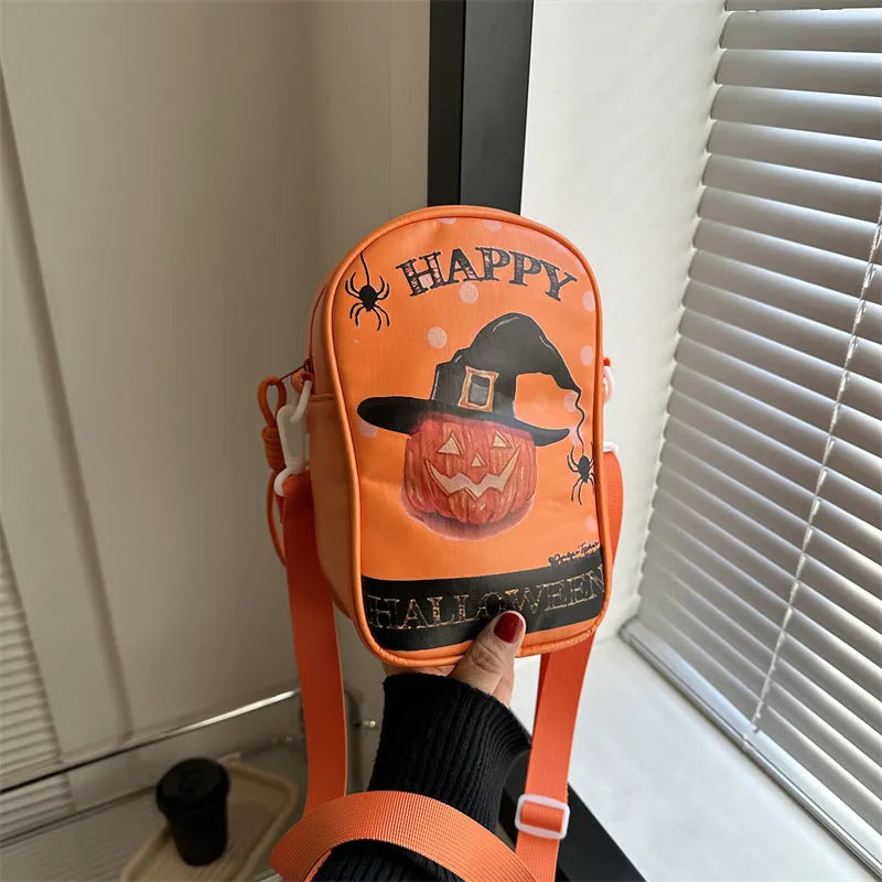 Black mini square crossbody bag with orange Halloween graffiti print of cartoon pumpkin, ghost, and bat.