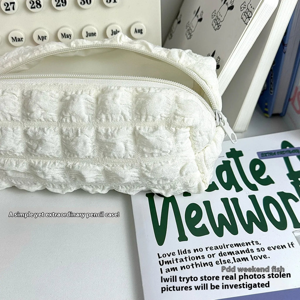 Fabric pencil case with cream puff design in beige and black colour options