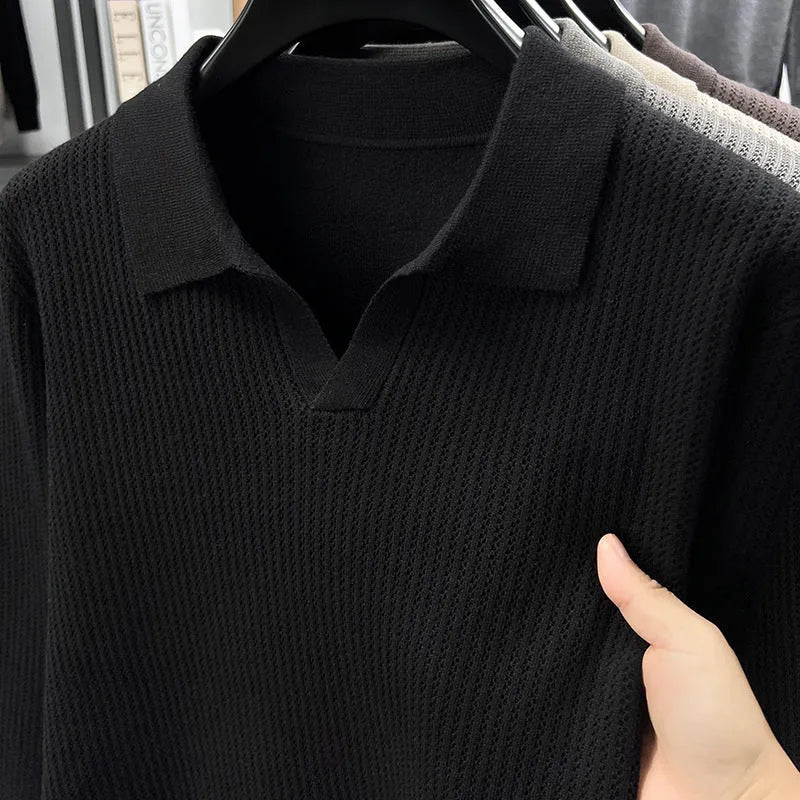 Man wearing a loose fit camel coloured casual pullover sweater.
