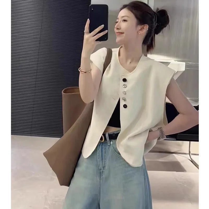 Women's loose fit vest with 40cm short length in milky white colour showing pocket detail