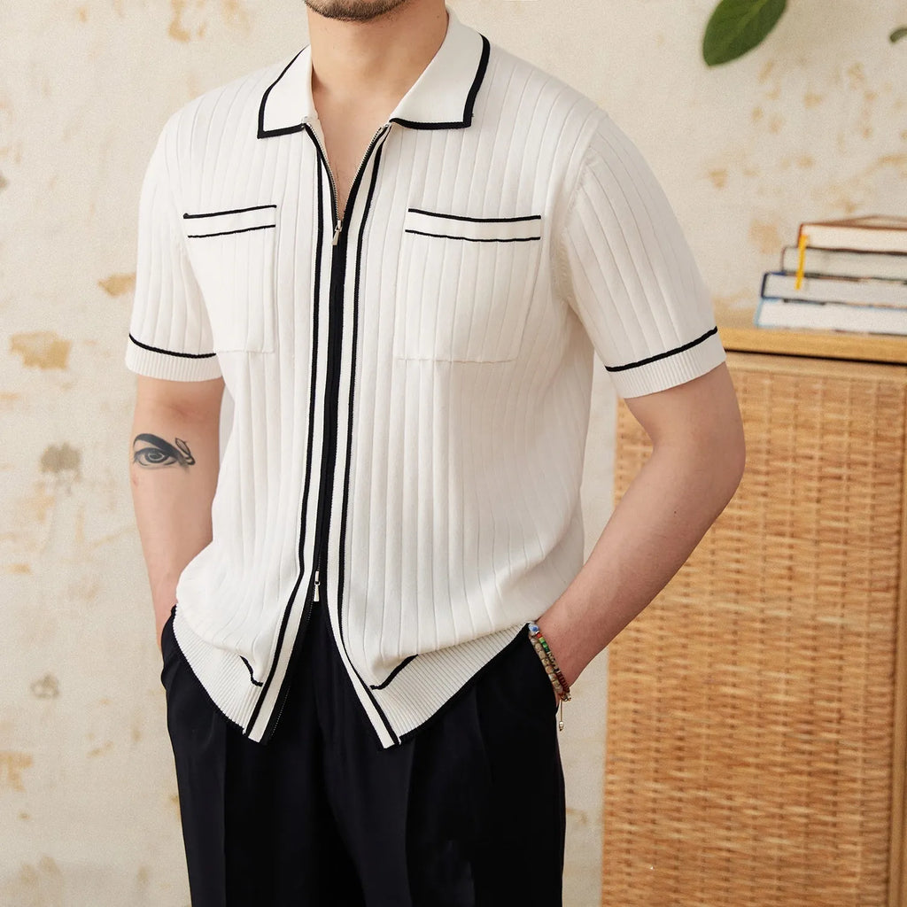 Slim fit black lapel polo shirt with short sleeves on a hanger.