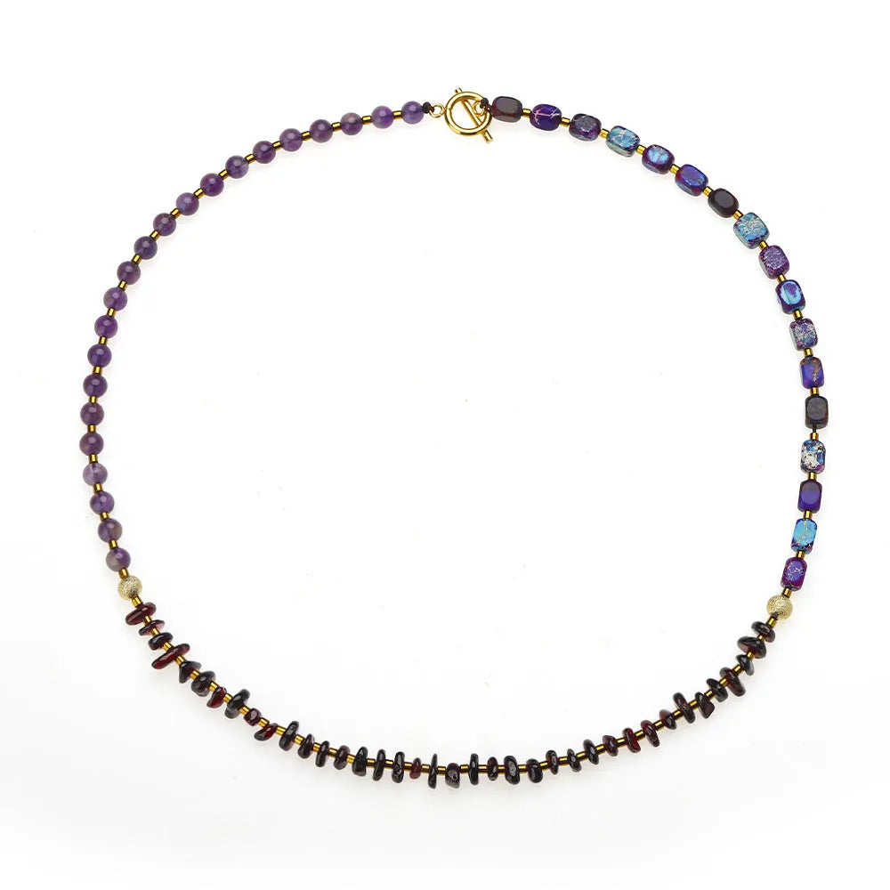 Purple amethyst and garnet stone bracelet with geometric beads and texture details