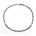 Purple amethyst and garnet stone bracelet with geometric beads and texture details
