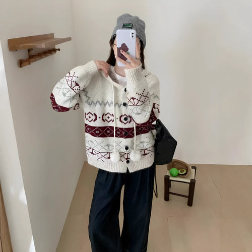 A beige, loose-fitting brocade knit sweater coat for plus size women with a geometric pattern.