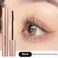 Black natural curly long mascara container with curved brush applicator showing 14cm length
