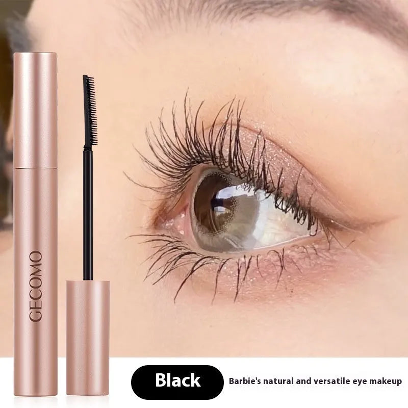 Black natural curly long mascara container with curved brush applicator showing 14cm length
