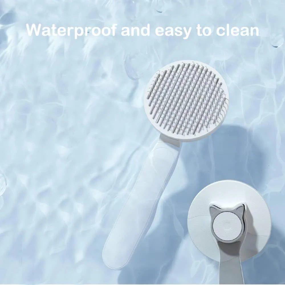 Blue self-cleaning cat grooming brush with one-click button and rubber-tipped needles