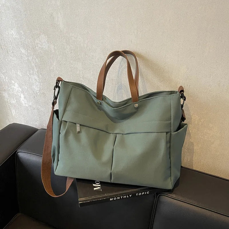 Women's nylon crossbody tote shoulder bag in black colour with measurements 39x14x28cm